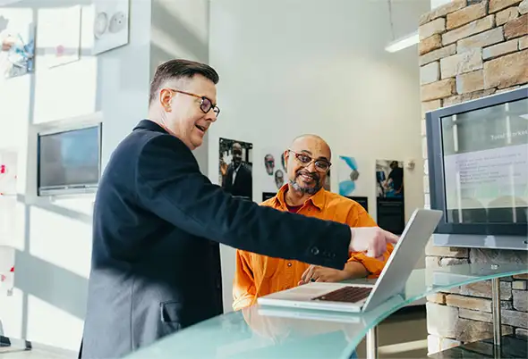 Coworkers at Laptop in Gallery