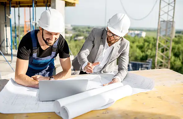 Construction workers with plans